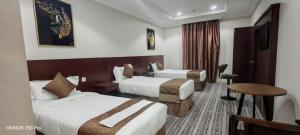 Postel nebo postele na pokoji v ubytování فندق سحر السيمت