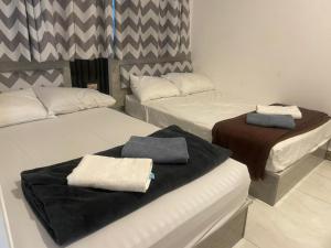 Postel nebo postele na pokoji v ubytování Yanaya Stay