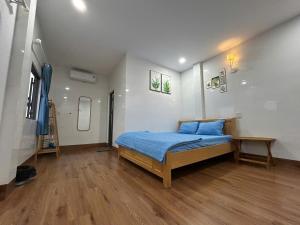 Ένα ή περισσότερα κρεβάτια σε δωμάτιο στο Dốc Biển Homestay Mui Ne