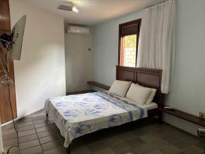 En eller flere senge i et værelse på Casa Beira Mar + 35 billeder