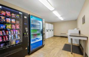 a soda vending machine in a store with drinks at Extended Stay America Suites - Charlotte - Pineville - Park Rd in Charlotte