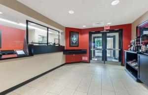 a fast food restaurant with red walls and a counter at Extended Stay America Suites - Baltimore - BWI Airport - Aero Dr in Linthicum Heights