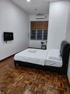 Ένα ή περισσότερα κρεβάτια σε δωμάτιο στο YNY Guest House