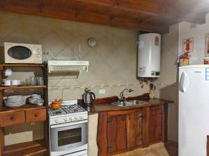 Kuchyň nebo kuchyňský kout v ubytování Cabañas Rey Garcia