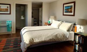 a bedroom with a bed and a walk in shower at Spring Hill in Forth