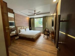 Voodi või voodid majutusasutuse Yatram toas