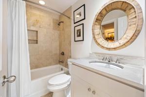 a bathroom with a sink and a toilet and a mirror at SS3559: 3559 Seascape in Kiawah Island +34 photos