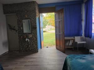 Ένα ή περισσότερα κρεβάτια σε δωμάτιο στο Hostal