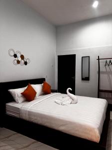 Ένα ή περισσότερα κρεβάτια σε δωμάτιο στο Isyana's hostel Batur +43 φωτογραφίες