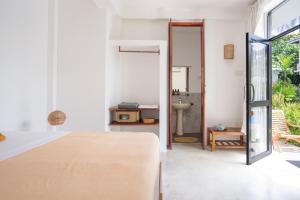 Postel nebo postele na pokoji v ubytování Venus Villa + 13 fotografií