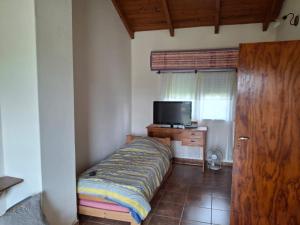 TV a/nebo společenská místnost v ubytování La casa del lago