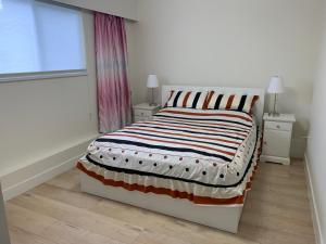 Ένα ή περισσότερα κρεβάτια σε δωμάτιο στο Modern 2-Bedroom suite