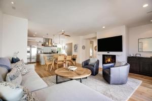 a living room with a couch and a table at Casa Playa in Santa Barbara