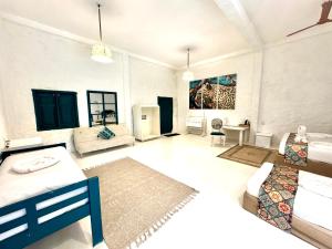 a large living room with a bed and a couch at Epic Wild Wilpattu exclusive private villa in Wilpattu