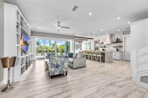 a living room with a couch and a kitchen at Beach Fanta Sea - 149 in Bailey Hall
