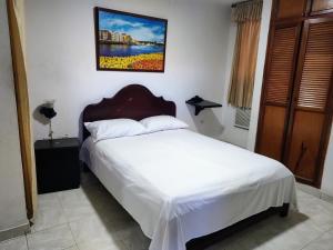 Postel nebo postele na pokoji v ubytování Hotel Tamaulipas Mixteca