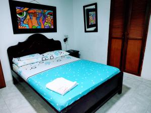 Postel nebo postele na pokoji v ubytování Hotel Tamaulipas Mixteca