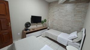 Postel nebo postele na pokoji v ubytování Quarto confortável em Diamantina + 10 fotografií