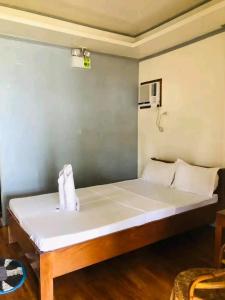 Ένα ή περισσότερα κρεβάτια σε δωμάτιο στο Coconut Beach Bar and Cottages