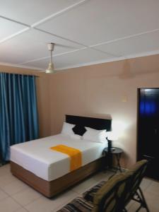 Ένα ή περισσότερα κρεβάτια σε δωμάτιο στο Mhlezi Lodge