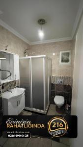 a bathroom with a shower and a toilet and a sink at 216 Blue Life in Istanbul