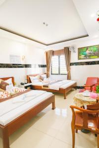 Ένα ή περισσότερα κρεβάτια σε δωμάτιο στο Phương Anh 9 Hotel