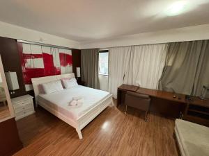 Ένα ή περισσότερα κρεβάτια σε δωμάτιο στο Hotel Meliá Ibirapuera Grandflats Suíte Master Luxo +43 φωτογραφίες