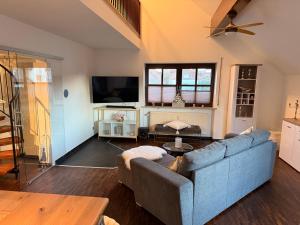 TV a/nebo společenská místnost v ubytování Deluxe Maisonette Ferienwohnung