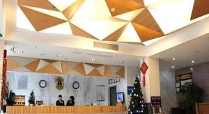 a lobby with a christmas tree and a large ceiling at Super 8 Hotel Fuzhou Jinjishan in Fuzhou
