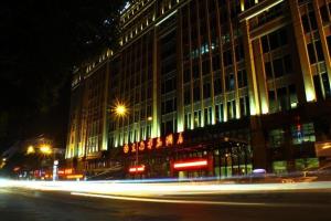 a building at night with light trails in front of it at Southeast Peninsula Hotel Quanzhou in Quanzhou