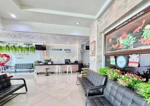 a lobby of a restaurant with chairs and a waiting room at Century Grand Hotel in Bung Kan +56 photos
