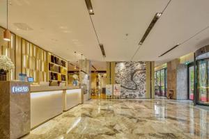 Ο χώρος του λόμπι ή της ρεσεψιόν στο Echarm Hotel Liuzhou High-speed Railway Station