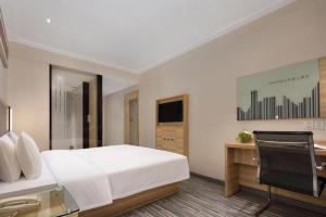 TV a/nebo společenská místnost v ubytování City Comfort Inn Changsha Window of the World Zhongmao City