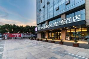 a large building with a lot of windows at Echarm Hotel Nanjing Lishui High-speed Railway Station Wuzhou Commercial City in Lishui