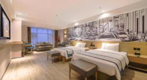 Postel nebo postele na pokoji v ubytování City Comfort Inn Shiyan High-speed Railway Wanda Plaza + 160 fotografií