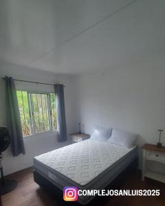 Ένα ή περισσότερα κρεβάτια σε δωμάτιο στο Complejo San Luis +16 φωτογραφίες