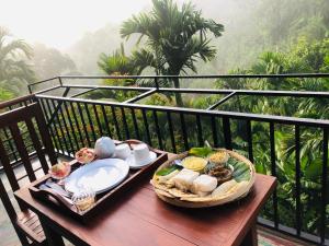 a tray of food on a table on a balcony at New Arch Heaven Ella in Ella