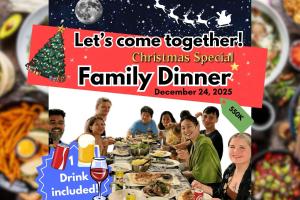a group of people sitting at a christmas special family dinner at EasyLife Villa Hội An in Tân Thành (1)