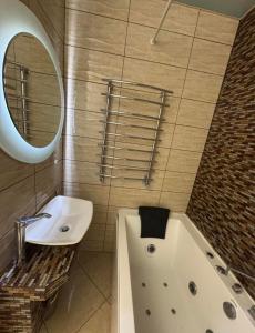 Ванная комната в Центр Чернівці по добові апартаменти Воробкевича 31а, Водограй, Черемош Автовокзал