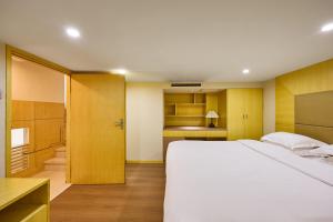 Giường trong phòng chung tại 北京和乔丽致酒店