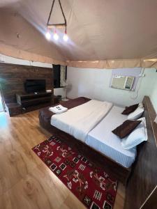 a bedroom with a bed in a tent at Satpura Adventure Resort in Pachmarhī