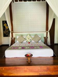 Ένα ή περισσότερα κρεβάτια σε δωμάτιο στο Bali Marina Villa's +42 φωτογραφίες