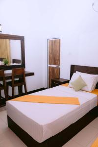 Postel nebo postele na pokoji v ubytování Yala Homestay by Set