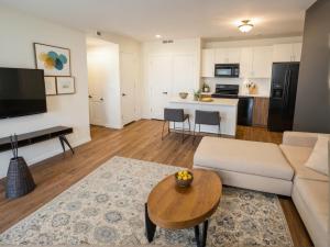 a living room with a couch and a table at Art District Downtown Spacious Homes in Los Angeles