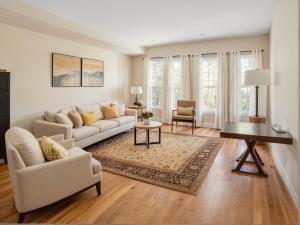 a living room with a couch and a table at Art District Downtown Spacious Homes in Los Angeles