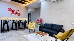 a living room with a couch and a table at Leisure29 Suites in Kuantan