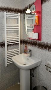 a bathroom with a sink and a mirror at Tokastro2 in Arachova