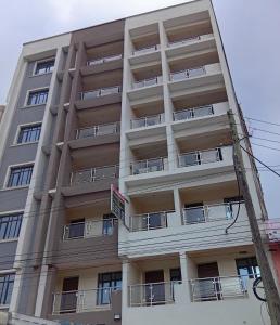 an apartment building with balconies on the side of it at JO kitengela deluxe Two and one bedroom in Kitengela 
