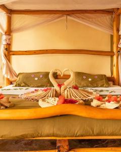 Postel nebo postele na pokoji v ubytování Manyatta Camp