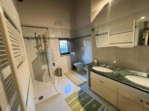 a bathroom with a sink and a shower and a toilet at Historic Villa Among Olive Groves In Arezzo in San Polo +23 photos